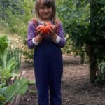 Carrie holding a tomato