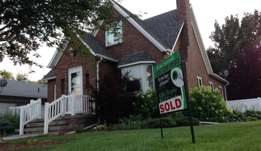 House with sold sign